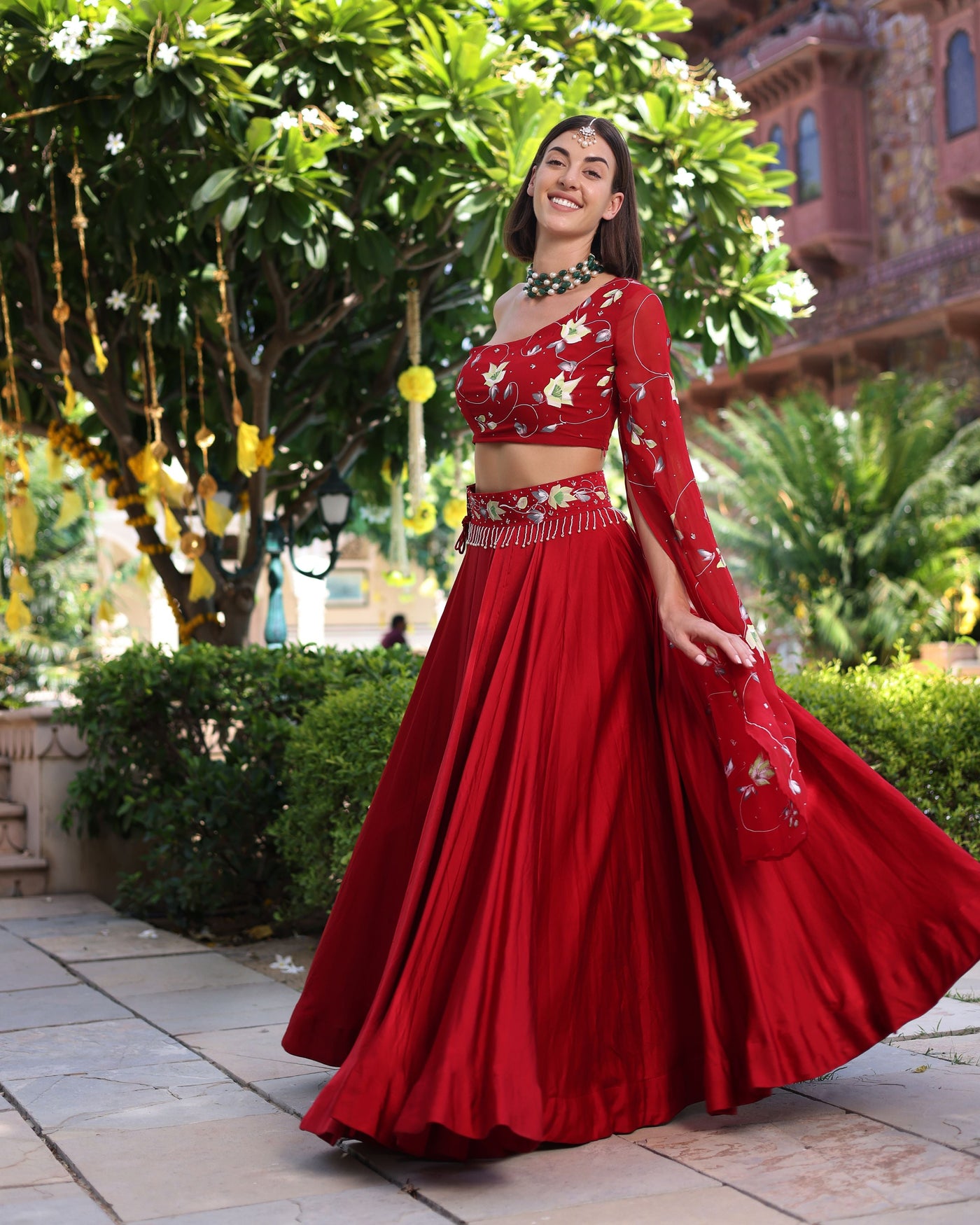 Rutvi Red Handpainted Satin Lehenga Set